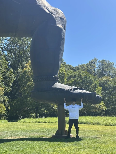 Photo infront of an art monument at the Storm King Art Center in New York, Summer 2025